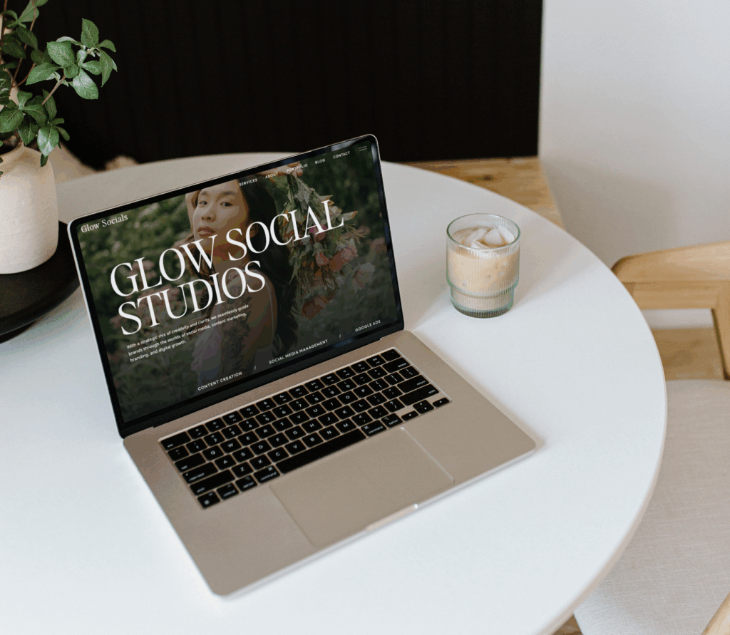 Showit social media website on laptop on coffee table
